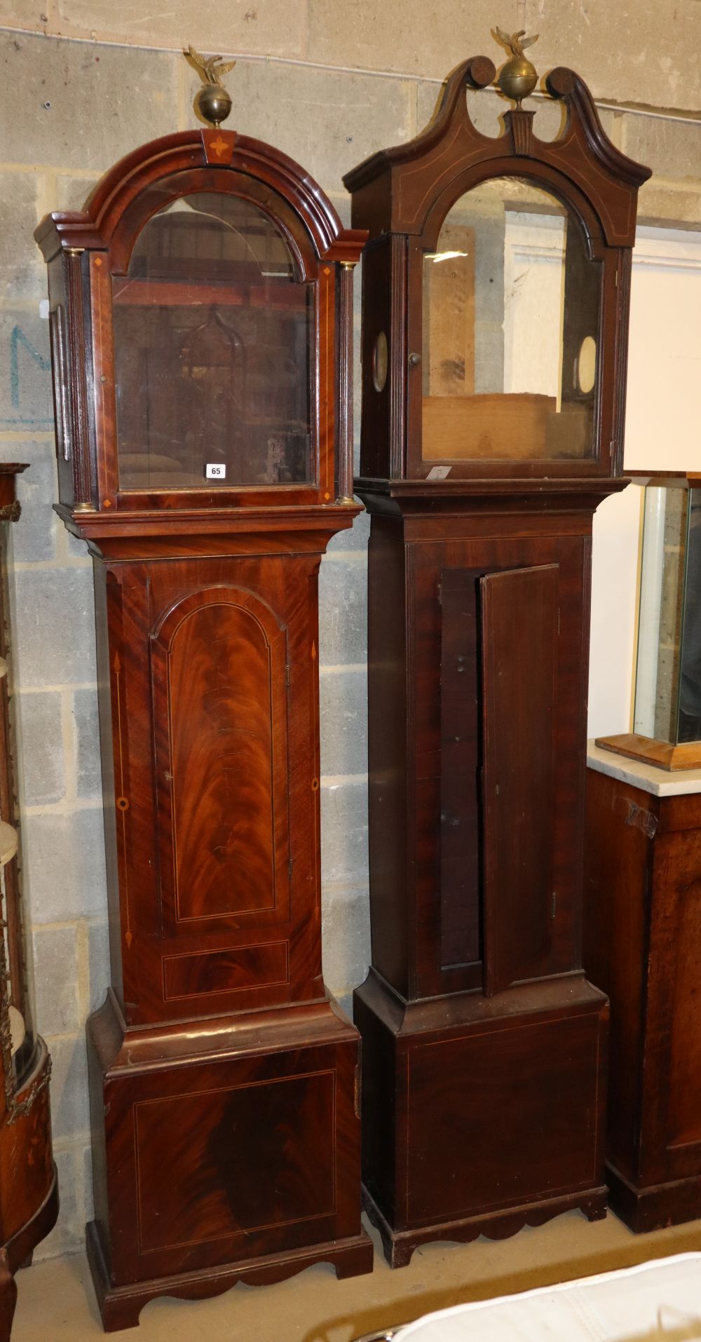 Two George III mahogany longcase clock cases, larger W.48cm, D.24cm, H.221cm